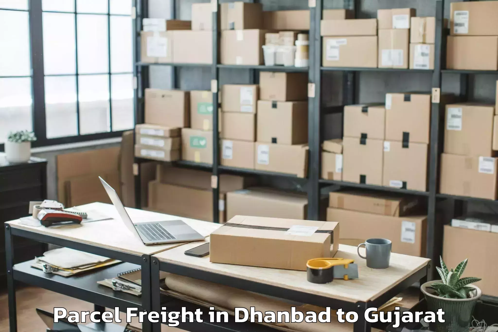 Book Your Dhanbad to Abhilashi University Ahmedabad Parcel Freight Today